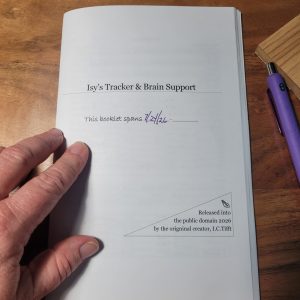 Half-fold booklet, titled Isy's Tracker and Brain Support. There is a note on the cover stating that the author placed this in the public domain in 2026. There is a typo. 